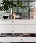 Modern dresser with 6 Piece Iridescent Pink Crystal Cabinet Knob Set With Silver Finish, enhancing furniture elegance.