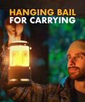 Man carrying Red Candle Lantern For Camping And Emergencies, A Must-Have For Backcountry Prep, Lets You Run 3 Nine-Hour Emergency Candles, Lightweight Aluminum Hanging Lantern For Backpacking, Hiking, And Outdoor Adventures