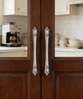 10 Pack 3 Inch Center Hole Brushed Nickel Cabinet Pulls Heavy Duty Solid Drawer Handles installed on wooden kitchen doors.