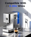 Stainless steel espresso machine with blue water tank on kitchen counter with glass of coffee and power cord compatible with 0.28in wires.