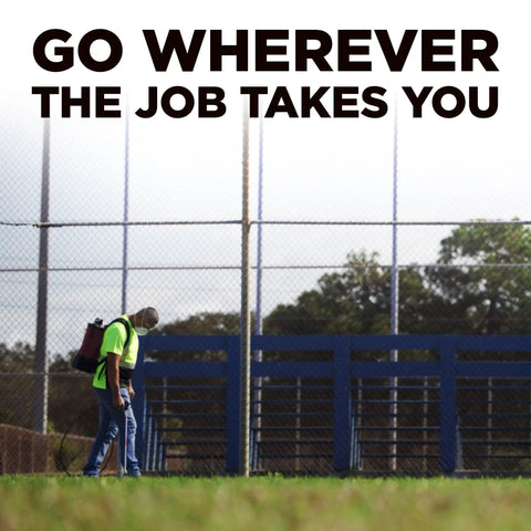 Tough As Nails 18V Cordless Airless Paint Sprayer With Advanced HEA Tech used by worker on job site, grassy area, bright daylight.