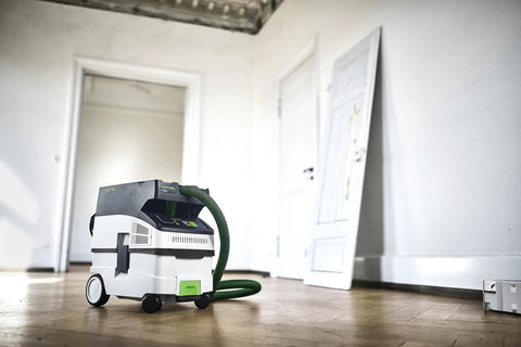CT MIDI I Dust Extractor With HEPA Filter, Bluetooth Start, AutoClean System, Heavy Duty Suction Power, And Touch Controls in a room