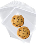 300 Count 4x6 Inch Self Adhesive Cellophane Bags 2.8 Mil Clear Plastic Bags with cookies inside, ideal for bakery packaging