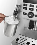 Super Automatic Espresso Machine With A Quiet Built In Grinder And One Touch Milk Frother Making Killer Daily Brews Using 15 Bar Pressure For A Smooth Relaxing Morning Routine In Sleek Silver Finish with milk frother and metal pitcher.