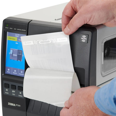 Slick ZT231 Upgraded Thermal Transfer Industrial Printer For Business Labeling with hand feeding label on output.