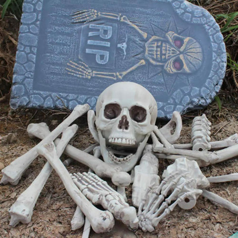 28 Piece Skeleton Bones And Skull Set For Halloween Decor Spooky Graveyard Ground Props with tombstone backdrop