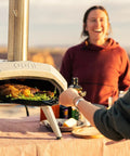 Karu 12 Multi Fuel Outdoor Portable Pizza Oven Delivers 950 F Heat For Wood Or Propane Cooks 12 Inch Pizzas In 60 Seconds