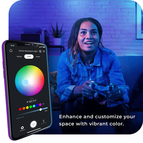 Woman using Ultra Slim 6 Inch Wi Fi Smart Recessed Lighting Kit 2 Pack with phone app for voice-activated RGB lighting