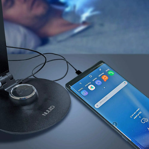 LED Desk Lamp For Home Office And Upright Piano, USB charging port used with smartphone, dimly lit room, black finish