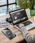 Hassle Free Embedded Desk Wireless Charger With Recessed Grommet Mount delivers fast power, shown on a wood desk with a laptop.