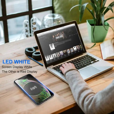 Hassle Free Embedded Desk Wireless Charger With Recessed Grommet Mount delivers fast power, shown on a wood desk with a laptop.