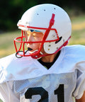 Youth athlete wearing Six Piece Strapped Mouth Guards With Strap No Boil Breathable Mouthpiece for Football under helmet
