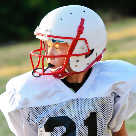 Youth athlete wearing Six Piece Strapped Mouth Guards With Strap No Boil Breathable Mouthpiece for Football under helmet