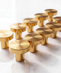 Gold Metal Cabinet Knobs 10 Pack - Round Drawer Pulls with brushed finish arranged on white surface