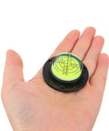 4pcs Acrylic Cylindrical Mini Spirit Level Tool for Precise Measuring in hand, featuring bubble level for accurate measuring.
