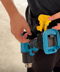 Heavy Duty Drill Belt Clip Hook With Auto Lock Release Mechanism For Cordless Drivers Hammer Drills And Impact Tools secured to belt, hands adjusting clip.