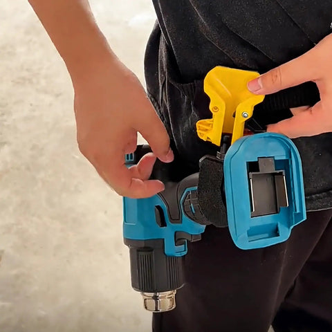 Heavy Duty Drill Belt Clip Hook With Auto Lock Release Mechanism For Cordless Drivers Hammer Drills And Impact Tools secured to belt, hands adjusting clip.