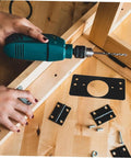 Installation of Stainless Steel Hinge Repair Kit Two Pack Durable Mending Plates For Cabinet Doors And Wardrobes on wood surface