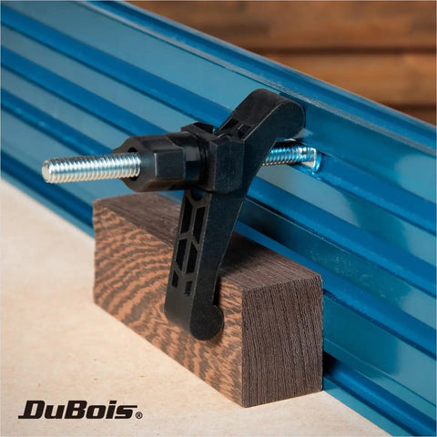 Heavy Duty T Track Hold Down Clamp Set For CNC Machines Table Saws Drill Presses And Workbenches Includes Two Five Sixteenths Inch T Bolts Two Thumb Knobs Two Swivels And Two Clamps For Fast Secure Woodworking Setups holding wood in blue T-track
