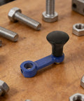 Heavy Duty Rotary Tiller Handle Attachment Two Pack With Manual Hand Crank Lift, blue handle with comfort grip on wood surface