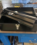 Portable 16 Inch Metal Toolbox With Heavy Duty 18 Gauge Steel Construction Black Large Tool Box Drawer Organizer Tackle Box Style With Metal Latch And Handle Corrosion Resistant Powder Coat For Home Garage Workshop on a table.