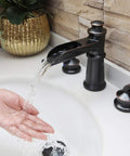 Waterfall Style Widespread Bathroom Faucet With 8 To 16 Inch Mounting Three Hole Two Handles Pop Up Drain Overflow in use