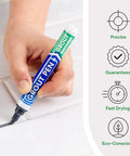 Hand using Dark Grey Grout Pen For Tile Grout Paint Marker Waterproof Colorant With Narrow 5mm Tip for touch-ups on tiles
