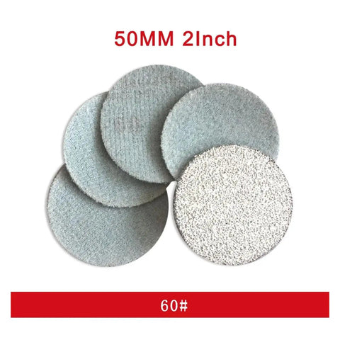 Get 300 Pcs Of Pro Grade 2 Inch Round White Hook And Loop Sanding Discs With Peel Switch Backing For Effortless Tool Free Swapping Plus Dust Venting Holes To Keep Your Work Area Clean While You Crush It Like A Boss, showing various sanding discs.