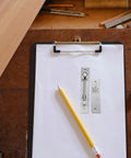 Heavy Duty Hidden Door Hinge Stainless Steel Concealed Cabinet Pivot Hinge on clipboard with pencil