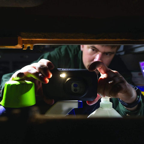 Person using Pocket Size Infrared Thermography Camera With WiFi And Cloud Access for inspection in a dark space