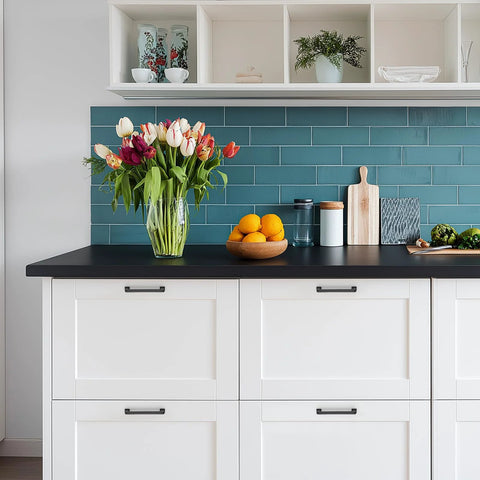 White kitchen cabinets with 10 pack 5 inch matte black cabinet handles made from solid zinc alloy, featuring modern decor and a vase with flowers.