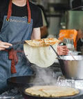 Person using Must Have Pro Grade Crepe Spreader And Spatula Kit Set 12 Inch Curved Offset Spatula in kitchen over pan