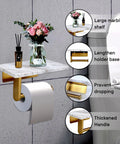 Dope Mega Roll Toilet Paper Holder With Natural Marble Shelf, Brushed Gold, shown with vase and diffuser, wall mounted.