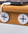 Eight Pack Three Quarter Inch Cable Cord Grommets for desk wall holes, white silicone rubber for cable management, installed on wooden desk
