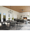 Covered patio with Two Light Outdoor Wall Lantern In Black Finish, Santee Style on walls, seating area, and fireplace view.