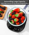 33 Lb Digital Kitchen Scale High Precision 0.1 Oz 1 G With LED Display showing 713g with strawberries and blueberries on top, black