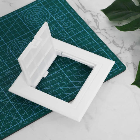 Sleek 3X3 Inch White Drywall Access Panel For Bathroom Plumbing Maintenance Durable Pvc Wall Cover Plate on green cutting mat.
