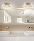 White and Gold Modern Metal Vanity Light Wall Sconce with Cone Shade 16 Inch LED Bulbs Installed Above Bathroom Mirror