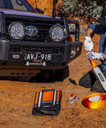 Man using RK12A Weekender Recovery Offroad Kit With 17500 Lb Snatch Strap 8000 Kg 2 Type S 4.75 Ton D Ring Shackles in desert terrain