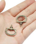 Mini Cabinet Pulls 10 Pack With Self Tapping Screws Antique Bronze Jewelry Box Handles And Drawer Knobs For Small Furniture DIY Projects Slick Zinc Alloy Hardware displayed on hand