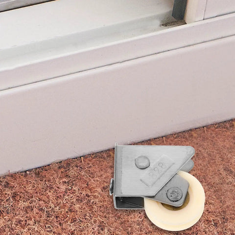 Heavy Duty Stainless Steel Sliding Door Pulley Roller With Double Bearing Adjustable Wheel showing nylon wheel on carpet.