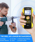 Person using 6 In 1 Wall Stud Finder And Detector With Updated Positioning Hole For Center And Edge On Wood, Metal Studs, Pipes, Joists, And Live AC Wires For Quick, No-Nonsense, Pro Grade Wall Scans.