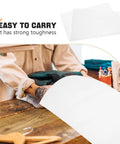 Person placing knitted item in 100 Pcs White Foam Pouches For Fragile Packing And Cushioning with text overlay 'Easy to Carry'