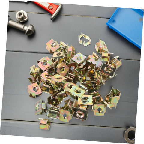 50 Pack Premium Automotive Fastener Clips Golden Iron Captive Nuts U Hook Bushings scattered on a surface.