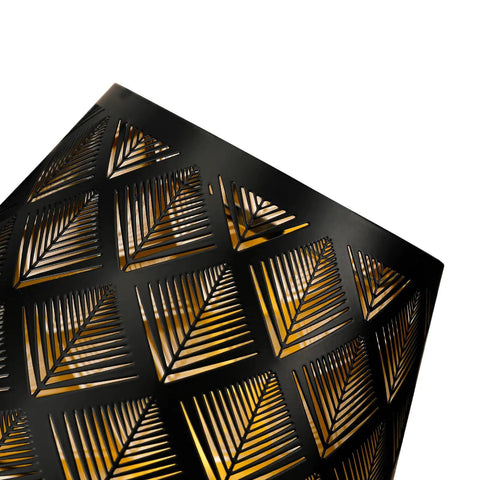 Close-up of a geometric black and gold lampshade design