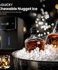 Smooth Crew Countertop Nugget Ice Maker With Tap On Dispenser Cranks Out Soft Chewable Ice Fast Keeps Drinks Frosty All Day Long Spits Out Thirty Five Pounds Daily Perfect For Backyard Hangouts Block Parties Or Lazy Weekend Brews with bottles of whiskey and nugget ice.