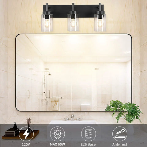 Vintage Vibes Wall Light Fixture With 3 Clear Glass Shades In Matte Black Finish illuminating a bathroom mirror