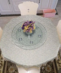 Rotating Glass Lazy Susan Turntable With 12mm Tempered Glass on dining table with flower centerpiece.