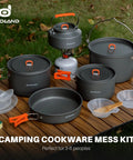 18Pcs Camping Cookware Set With Large Hanging Pots Pan And Kettle Plus Plastic Plates Bowls Spoon Spatula And Sponge on table