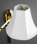 Polished Brass Wall Swing Arm Lamp with Off White Fabric Shade, showcasing classic style and traditional vibe in 15x25x24 dimensions.